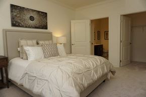 Troy apartment for rent - a bedroom with a large bed and a closet