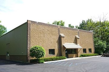 Albany apartment for rent - A building with a parking lot in front of it.