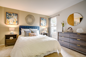 Martinez apartment for rent - A bedroom with a large bed and a mirror on the wall.