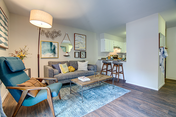 Martinez apartment for rent - A living room with a blue chair and a grey couch.