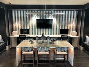 Phoenix apartment for rent - A modern kitchen with a marble table and striped wallpaper.