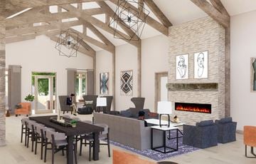 Nashville apartment for rent - A modern living room with a stone fireplace and a dining table set for four.