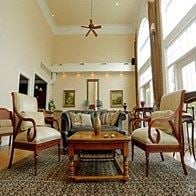 Shelby Twp apartment for rent - a living room filled with furniture and a ceiling fan