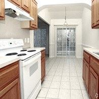 Shelby Twp apartment for rent - a kitchen with a white stove top oven and wooden cabinets