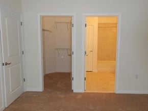 Middletown apartment for rent - an empty bedroom with two closets and a door to a bathroom