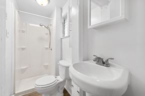 Philadelphia apartment for rent - a small bathroom with a sink toilet and shower