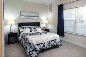 Middletown apartment for rent - a bedroom with a bed and two night stands and a window