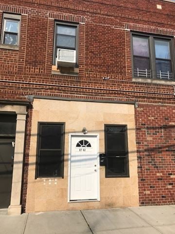 Ozone Park apartment for rent - a white door on the side of a brick building