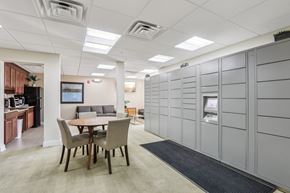 Allentown apartment for rent - A conference room with a table and chairs and a wall of lockers.