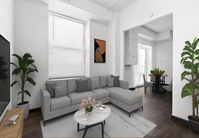 St Louis apartment for rent - a living room with a gray couch and a white table