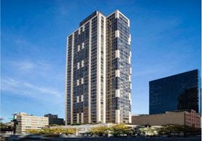 New York apartment for rent - a tall building in the middle of a city