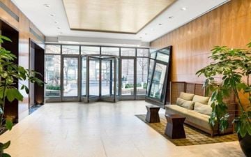 New York apartment for rent - a living room with a couch and a large window