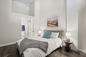 Richmond apartment for rent - a bedroom with a large bed and a window