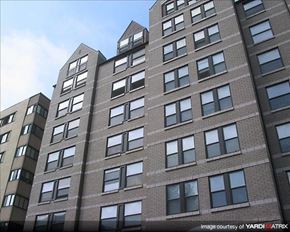 Washington apartment for rent - A tall building with many windows is shown in the image.