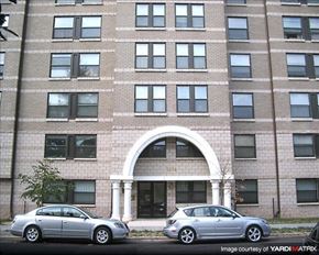 Washington apartment for rent - Two cars parked in front of a building with the number 2544 on it.