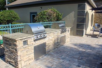 Outdoor kitchen with dual gas grills