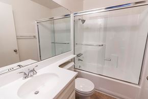 North Hollywood apartment for rent - A white bathroom with a sink, toilet, and shower.
