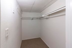 North Hollywood apartment for rent - A white closet with a carpeted floor and a white door.