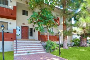 North Hollywood apartment for rent - A house with a red door and a number 10827 on the wall.