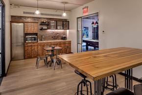 New York apartment for rent - a kitchen and dining room with a wooden table