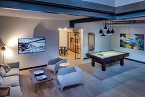 New York apartment for rent - a game room with a pool table and a tv