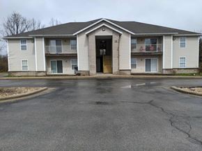 Aurora apartment for rent - a large white house with a street in front of it