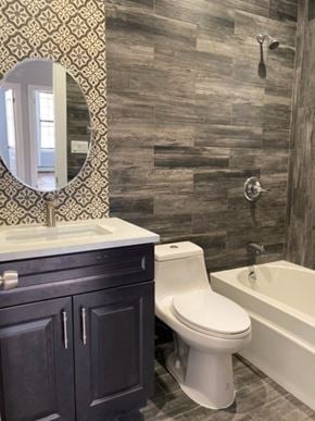 Brooklyn apartment for rent - a bathroom with a toilet and a sink and a bath tub