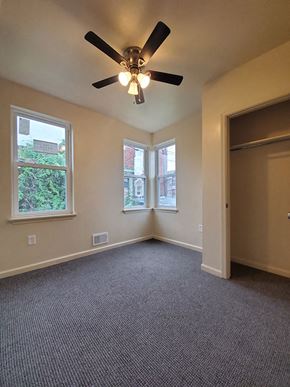 Philadelphia apartment for rent - A room with a ceiling fan and carpeted floor.
