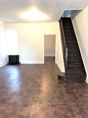 Philadelphia apartment for rent - A room with a staircase and a radiator.