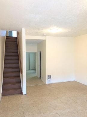 Philadelphia apartment for rent - A room with a staircase and a door.