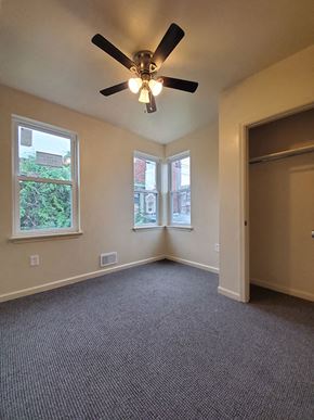 Philadelphia apartment for rent - A room with a ceiling fan and carpeted floor.