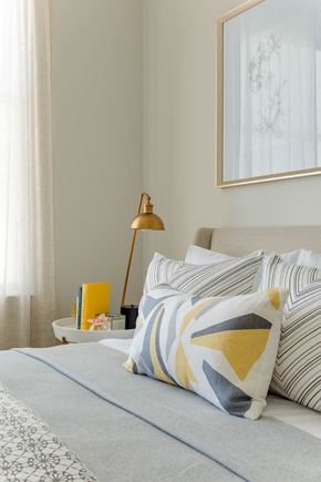 Woburn apartment for rent - a bedroom with a bed and pillows and a lamp