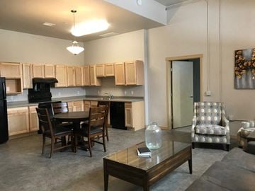 Mandan apartment for rent - a living room and kitchen with a table and chairs