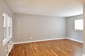 Forest Park apartment for rent - an empty living room with wood floors and a window