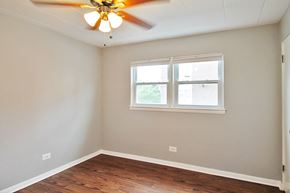Forest Park apartment for rent - an empty room with a ceiling fan and a window