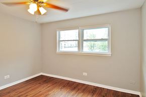 Forest Park apartment for rent - an empty room with a window and a ceiling fan