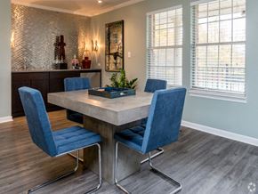 Indianapolis apartment for rent - a dining room with a marble table and blue chairs