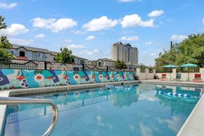 Denver apartment for rent - a large swimming pool with a fence around it