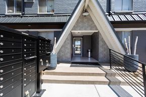 Denver apartment for rent - the front entrance to a house with stairs and a black door