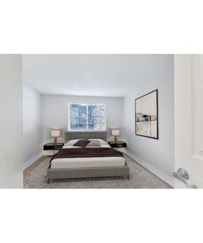 Denver apartment for rent - a bedroom with a bed and a window