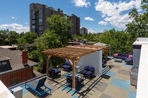 Denver apartment for rent - a roof terrace with chairs and a wooden pergola