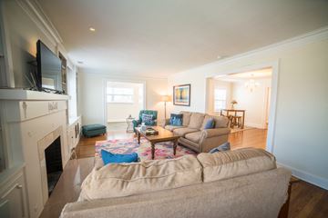 Kansas City triplex for rent - a living room with a couch and a tv