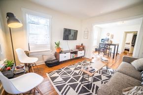 Kansas City apartment for rent - a living room with a couch and a table and a tv