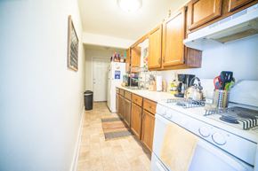 Kansas City apartment for rent - a kitchen with a stove top oven and a sink