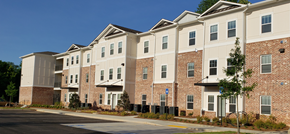 Decatur apartment for rent - a brick apartment building with a street in front of it