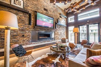 Clubroom with smart tv and fireplace