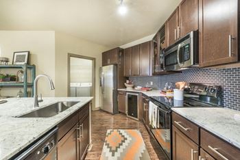 Fitted kitchen with island dining