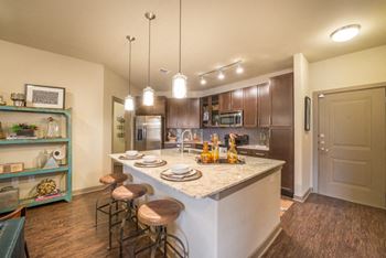 Fitted kitchen with island dining