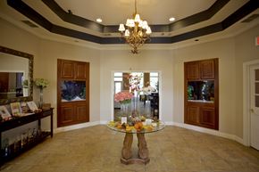 Avon Lake apartment for rent - a dining room with a glass table and a chandelier