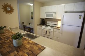 Avon Lake apartment for rent - a kitchen with white appliances and a counter top